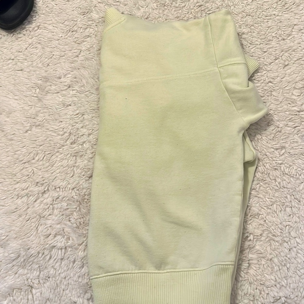 a light green sweater